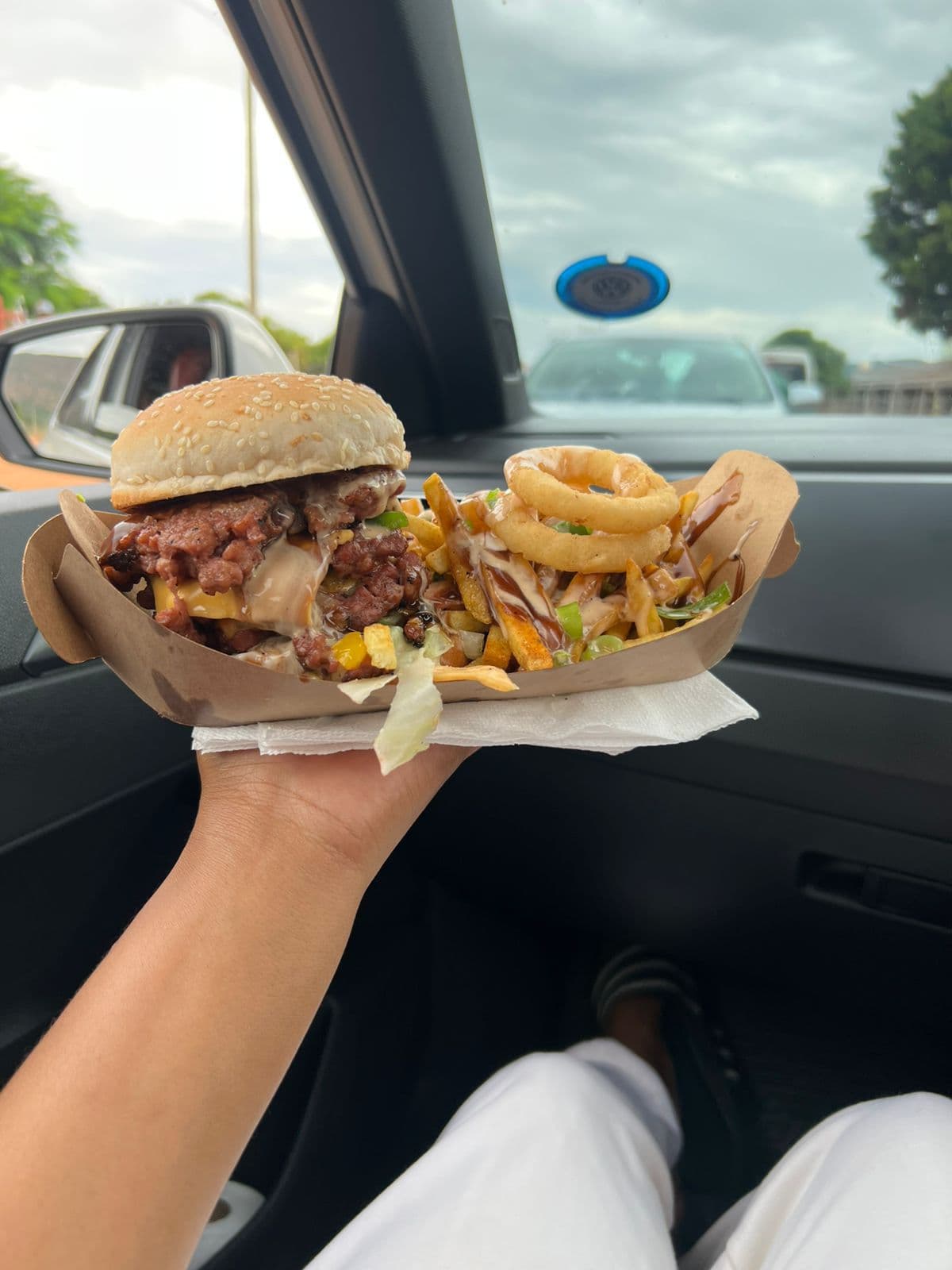 RAK'ENG signature beef burger with fries and onion rings